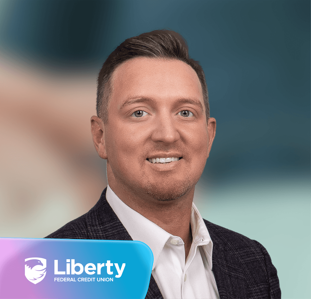 Smiling man in business attire with Liberty Federal Credit Union logo.