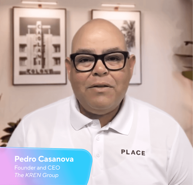 Pedro Casanova, Founder and CEO of The KREN Group, a bald man in glasses and a white polo shirt with "PLACE" written on it.