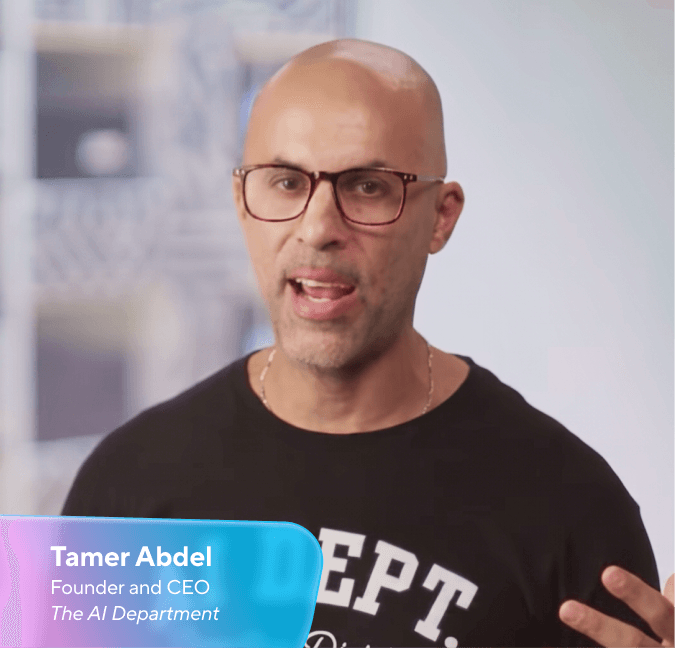 Tamer Abdel, a bald man with glasses, speaking.