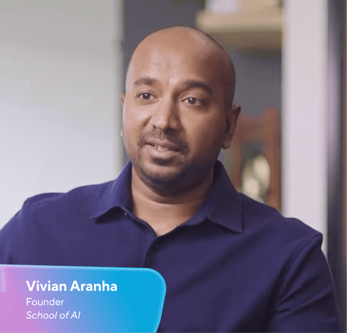 Vivian Aranha, Founder School of AI, a bald man with dark skin in a dark blue shirt, smiling.
